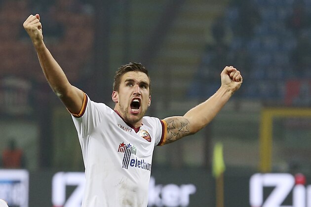 AS Roma midfielder Kevin Strootman, of the Netherlands, celebrates after scoring during the Serie A soccer match between AC Milan and Roma at the San Siro stadium in Milan, Italy, Monday, Dec. 16, 2013. (AP Photo/Antonio Calanni)