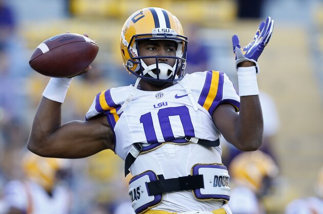 LSU quarterback Anthony Jennings (10) warms up before an NCAA college football game against Mississippi in Baton Rouge, La., Saturday, Oct. 25, 2014. (AP Photo/Jonathan Bachman)