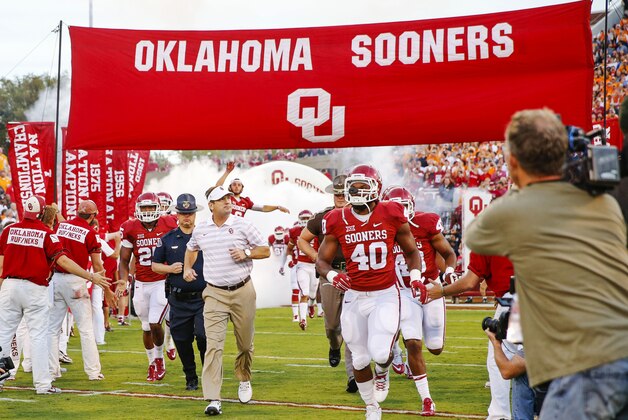 Sep 13, 2014; Norman, OK, USA; Oklahoma Sooners head coach Bob Stoops runs onto the field before the game against the Tennessee Volunteers at Gaylord Family - Oklahoma Memorial Stadium. Mandatory Credit: Kevin Jairaj-USA TODAY Sports