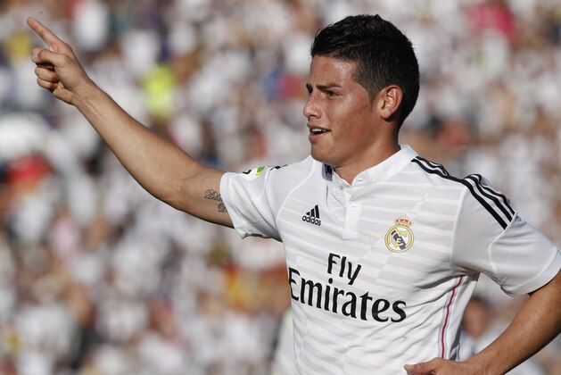 Real Madrid's James Rodriguez celebrates after scoring against Levante during a Spanish La Liga soccer match at the Ciutat de Valencia stadium in Valencia, Spain, on Saturday, Oct. 18, 2014.(AP Photo/Alberto Saiz)