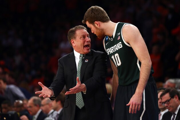 NEW YORK, NY - MARCH 28:  Head coach Tom Izzo of the Michigan State Spartans talks with Matt Costello #10 during the regional semifinal of the 2014 NCAA Men's Basketball Tournament at Madison Square Garden on March 28, 2014 in New York City.  (Photo by Elsa/Getty Images)