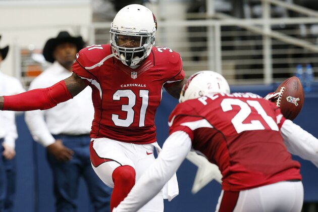 After interception the ball against the Dallas Cowboys, Arizona Cardinals cornerback Antonio Cromartie (31) celebrates with cornerback Patrick Peterson (21) during the second half of an NFL football game Sunday, Nov. 2, 2014, in Arlington, Texas. (AP Photo/Sue Ogrocki)