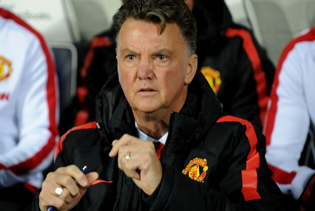 Manchester United manager Louis van Gaal watches in the dug out during the English Premier League soccer match between West Bromwich Albion and Manchester United at the Hawthorns, Birmingham, England, Monday, Oct. 20, 2014. (AP Photo/Rui Vieira)