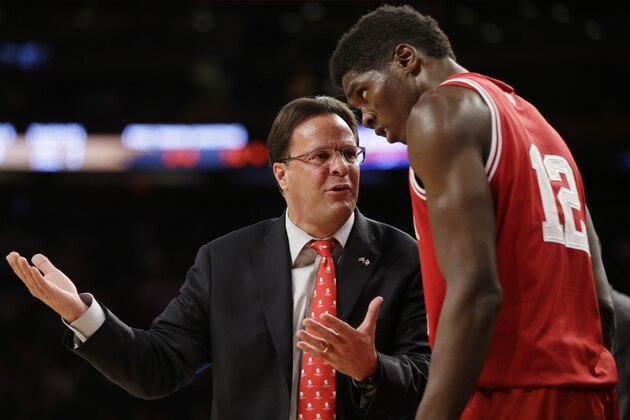 Indiana head coach Tom Crean, left, talks with Hanner Mosquera-Perea during the first half of an NCAA college basketball game against Washington Thursday, Nov. 21, 2013, in New York. (AP Photo/Seth Wenig)
