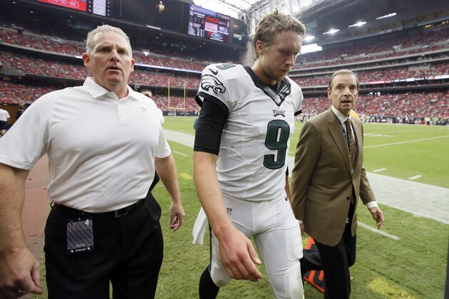 Philadelphia Eagles quarterback Nick Foles walks off the field after being injured during the first half of an NFL football game against the Houston Texans, Sunday, Nov. 2, 2014, in Houston. (AP Photo/Tony Gutierrez)
