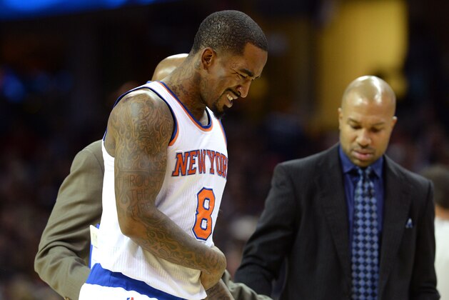 CLEVELAND, OH - OCTOBER 30: J.R. Smith #8 of the New York Knicks walks to the bench with a possible injury in the first half against the Cleveland Cavaliers at Quicken Loans Arena on October 30, 2014 in Cleveland, Ohio. NOTE TO USER: User expressly acknowledges and agrees that, by downloading and or using this photograph, User is consenting to the terms and conditions of the Getty Images License Agreement.  (Photo by Jason Miller/Getty Images)