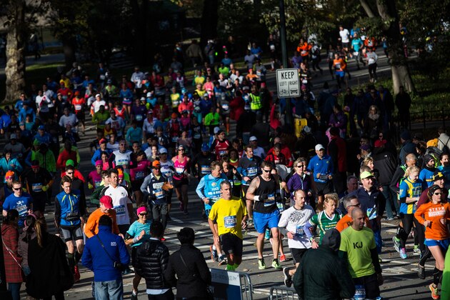 NEW YORK, NY - NOVEMBER 02:  Runners run through Central Park during the TCS New York City Marathon on November 2, 2014 in New York City.  (Photo by Andrew Burton/Getty Images)
