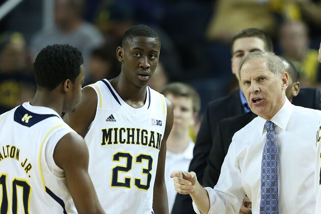 ANN ARBOR, MI - FEBRUARY 05: University of Michigan head coach John Beilein talks with Derrick Walton Jr #10 Caris LeVert #23 and Nik Stauskas #11 during the first half of the game against the Nebraska Cornhuskers at Crisler Arena on February 5, 2014 in Ann Arbor, Michigan. The Wolverines defeated the Cornhuskers 79-50. (Photo by Leon Halip/Getty Images)