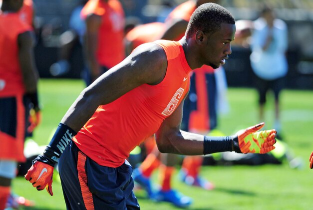 Jul 9, 2014; Beaverton, OR, USA; Alpha Pro athlete Torrance Gibson (6) heads off the line of scrimmage during Nike Football ' The Opening' at Nike World Headquarters. Mandatory Credit: Steve Dykes-USA TODAY Sports
