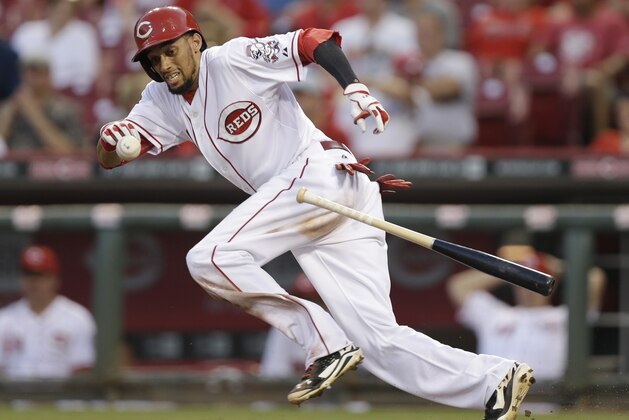 Cincinnati Reds' Billy Hamilton bunts for an out against the Chicago Cubs in the third inning of a baseball game, Wednesday, Aug. 27, 2014, in Cincinnati. (AP Photo/Al Behrman)