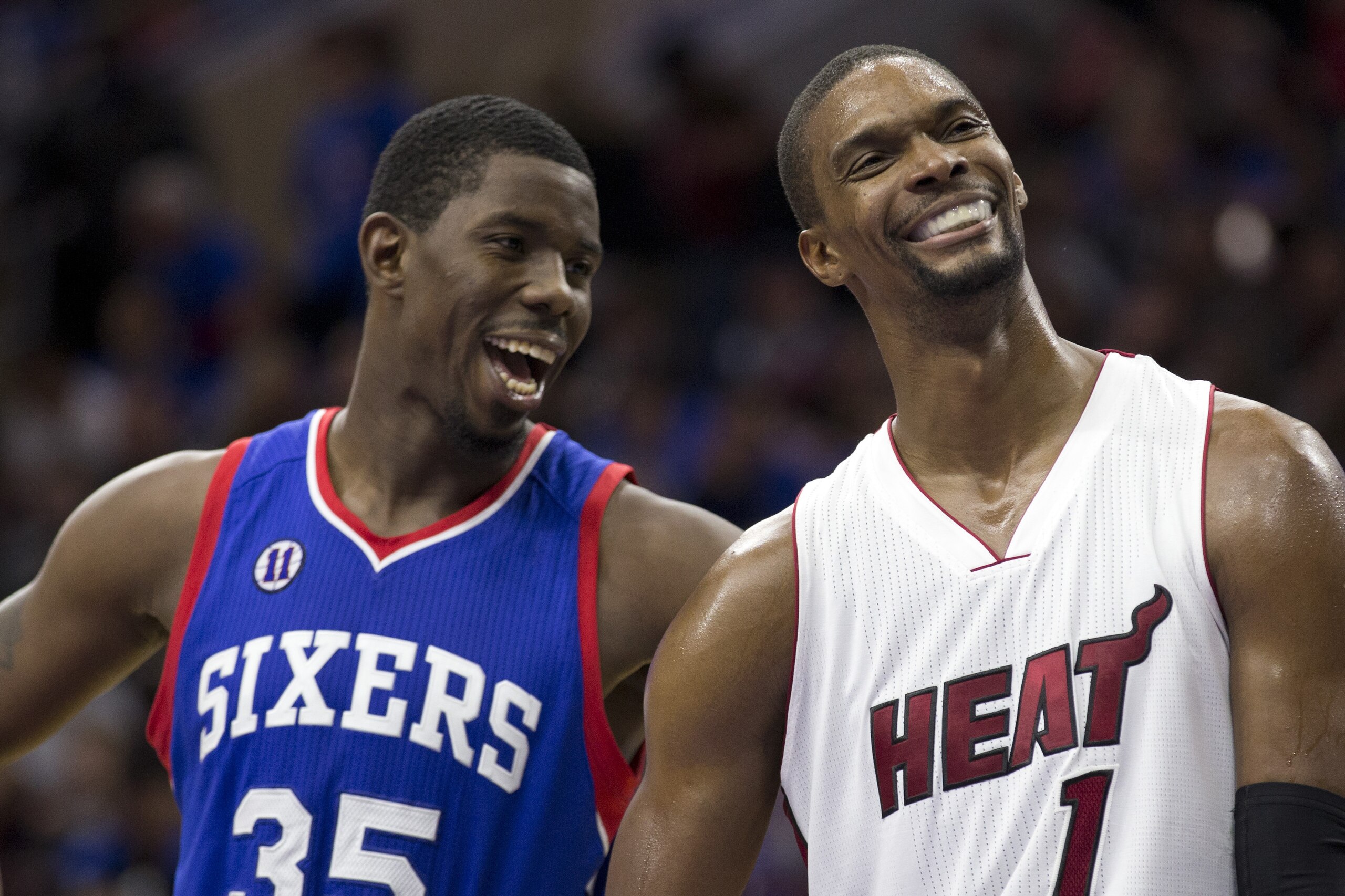 PHILADELPHIA, PA - NOVEMBER 1: Henry Sims #35 of the Philadelphia 76ers talks to Chris Bosh #1 of the Miami Heat in between foul shots in the second half of the game on November 1, 2014 at the Wells Fargo Center in Philadelphia, Pennsylvania. NOTE TO USER: User expressly acknowledges and agrees that, by downloading and or using this photograph, User is consenting to the terms and conditions of the Getty Images License Agreement The Heat defeated the 76ers 114-96 (Photo by Mitchell Leff/Getty Images)