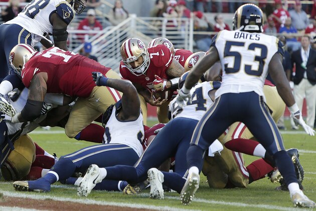 San Francisco 49ers quarterback Colin Kaepernick (7) runs before losing a fumble against the St. Louis Rams during the fourth quarter of an NFL football game in Santa Clara, Calif., Sunday, Nov. 2, 2014. The Rams won 13-10. (AP Photo/Marcio Jose Sanchez)