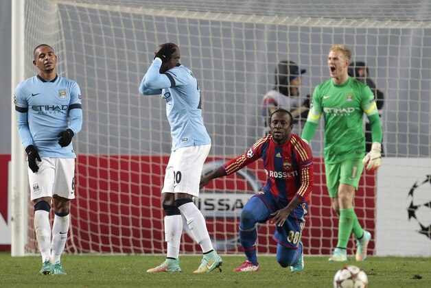 Manchester City players react after referee Istvan Vad awarded a penalty to CSKA during the Champions League Group E soccer match between CSKA Moscow and Manchester City at Arena Khimki stadium in Moscow, Russia, Tuesday Oct. 21, 2014. (AP Photo/Ivan Sekretarev)
