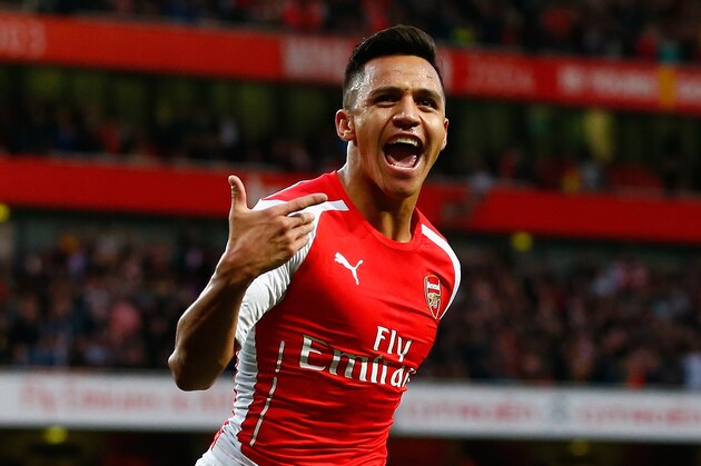 LONDON, ENGLAND - NOVEMBER 01:  Alexis Sanchez of Arsenal celebrates scoring the first goal during the Barclays Premier League match between Arsenal and Burnley at Emirates Stadium on November 1, 2014 in London, England.  (Photo by Julian Finney/Getty Images)