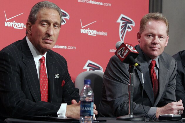 Arthur Blank, left, owner of the Atlanta Falcons and new Falcons coach Bobby Petrino, right, field questions during a news conference announcing Petrino as football coach at the Falcons complex in Flowery Branch, Ga., Monday, Jan. 8, 2007. (AP Photo/Gene Blythe)
