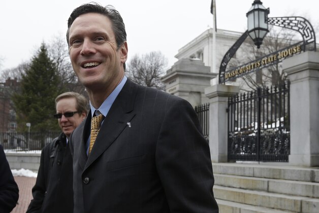 Former New England Patriots NFL quarterback Drew Bledsoe smiles following a news conference on the front steps of the Statehouse, in Boston, Thursday, March 21, 2013. Bledsoe, who now operates a winery in Washington state, lobbied Massachusetts lawmakers Thursday to lift the state's ban on direct shipments of wine from out-of-state producers. (AP Photo/Steven Senne)