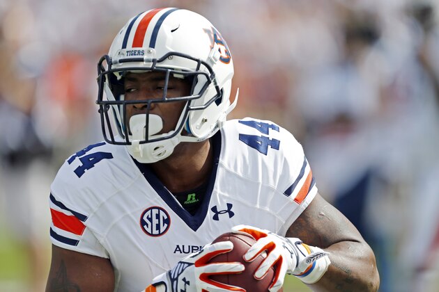 Auburn running back Cameron Artis-Payne (44) runs a drill before an NCAA college football game against Mississippi State in Starkville, Miss., Saturday, Oct 11, 2014.  (AP Photo/Rogelio V. Solis)