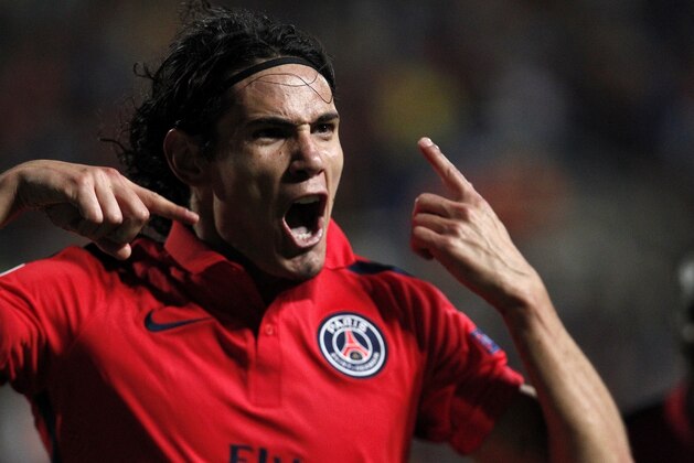 PSG's Edinson Cavani, celebrates after scoring against Apoel during the Champions League Group F soccer match between Apoel and Paris Saint Germain, at GSP stadium, Tuesday, Oct. 21, 2014. (AP Photo/Petros Karadjias)