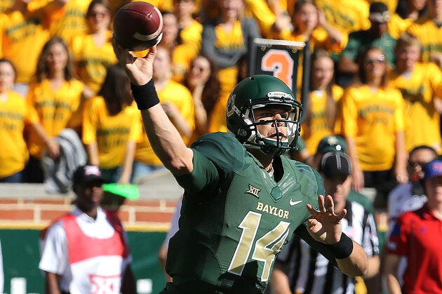 Baylor quarterback Bryce Petty (14) passes in a  NCAA college football game against Kansas, Saturday, Nov. 1, 2014, in Waco, Texas. (AP Photo/ Jerry Larson)