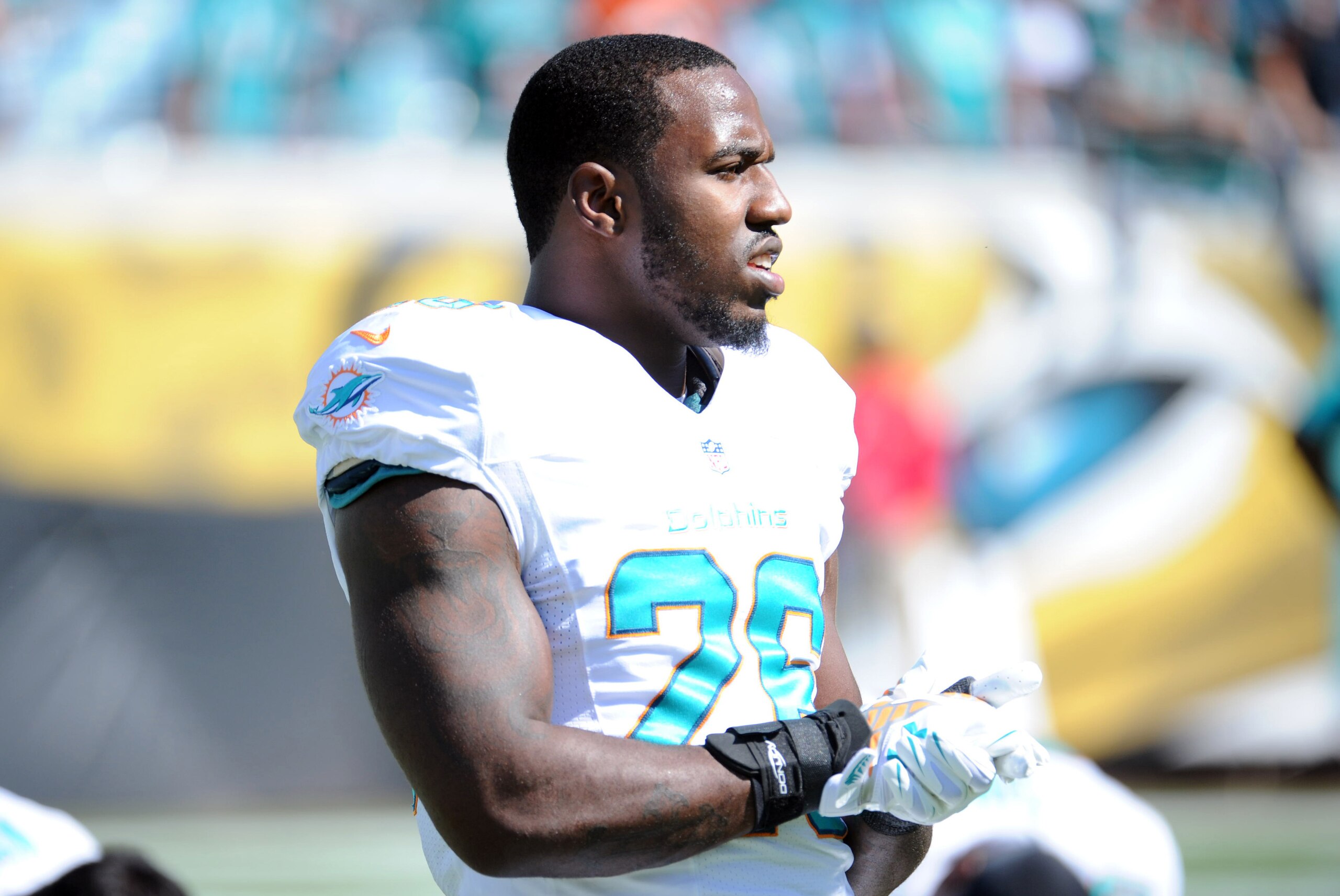 Oct 26, 2014; Jacksonville, FL, USA; Miami Dolphins running back Lamar Miller (26) looks on prior to the game against the Jacksonville Jaguars at EverBank Field. Mandatory Credit: Melina Vastola-USA TODAY Sports