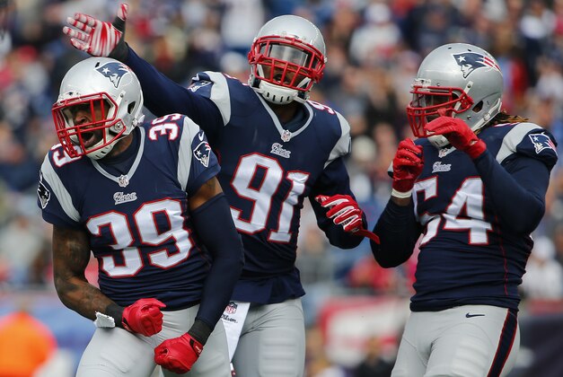 Oct 26, 2014; Foxborough, MA, USA; New England Patriots cornerback Brandon Browner (39) celebrates with outside linebacker Jamie Collins (91) and outside linebacker Dont'a Hightower (54) after breaking up a pass against the Chicago Bears during the first half at Gillette Stadium. Mandatory Credit: Winslow Townson-USA TODAY Sports