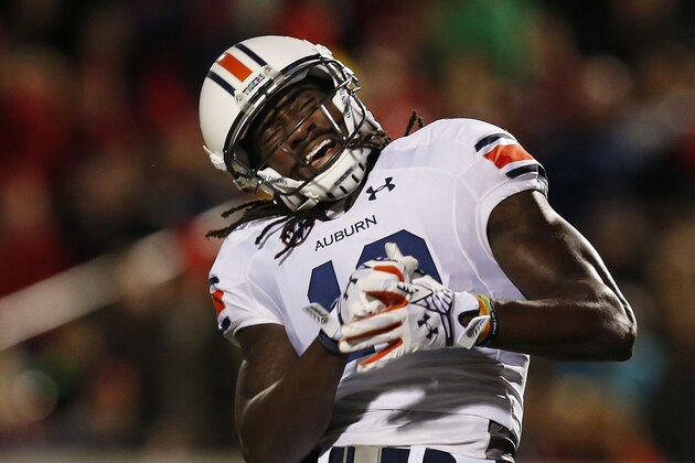 Auburn wide receiver Sammie Coates reacts after an incomplete pass from quarterback Nick Marshall during the first half of an NCAA college football game against Mississippi, Saturday, Nov. 1, 2014, in Oxford, Miss. (AP Photo/Brynn Anderson)