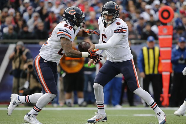 Chicago Bears quarterback Jay Cutler (6) hands off to running back Matt Forte (22) in the first half of an NFL football game against the New England Patriots on Sunday, Oct. 26, 2014, in Foxborough, Mass. (AP Photo/Elise Amendola)