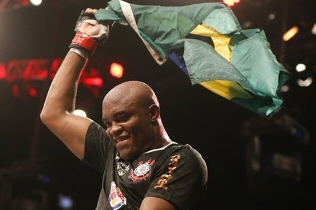 Anderson Silva, from Brazil, celebrates after defeating Stephan Bonnar, from the United States, during their light heavyweight mixed martial arts bout at UFC153 in Rio de Janeiro, early Sunday, Oct. 14, 2012. (AP Photo/Felipe Dana)