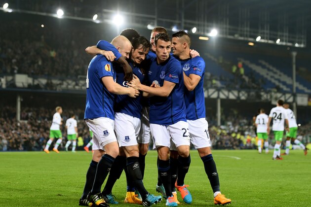 LIVERPOOL, ENGLAND - SEPTEMBER 18:  Leighton Baines (C) of Everton is congratulated by teammates after scoring his team's third goal from the penalty spot during the UEFA Europa League Group H match between Everton and VFL Wolfsburg on September 18, 2014 in Liverpool, United Kingdom.  (Photo by Shaun Botterill/Getty Images)
