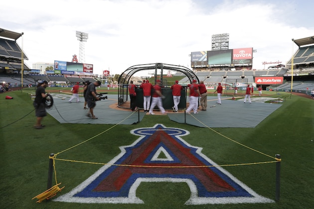 Los Angeles Angels players take batting practice before Game 2 of baseball's AL Division Series against the Kansas City Royals in Anaheim, Calif., Friday, Oct. 3, 2014. (AP Photo/Gregory Bull)