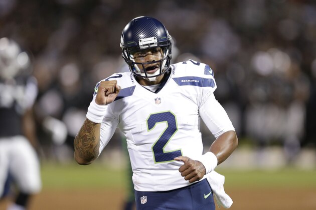 Seattle Seahawks quarterback Terrelle Pryor (2) celebrates after throwing a 33-yard touchdown pass to wide receiver Phil Bates during the second quarter of an NFL preseason football game against the Oakland Raiders in Oakland, Calif., Thursday, Aug. 28, 2014. (AP Photo/Marcio Jose Sanchez)