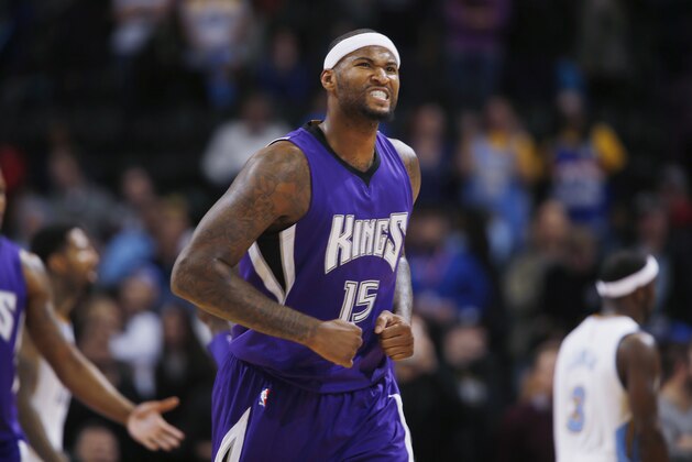 Sacramento Kings center DeMarcus Cousins reacts after hitting two free throws to give the Kings a five-point lead over the Denver Nuggets with only 30 seconds remaining in the fourth quarter of the Kings' 110-105 victory in an NBA basketball game in Denver on Monday, Nov. 3, 2014. (AP Photo/David Zalubowski)