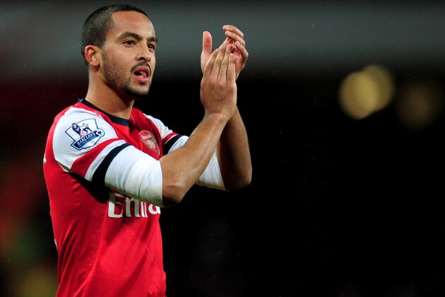 LONDON, ENGLAND - JANUARY 01:  Theo Walcott of Arsenal applauds the crowd after the Barclays Premier League match between Arsenal and Cardiff City at Emirates Stadium on January 1, 2014 in London, England.  (Photo by Shaun Botterill/Getty Images)