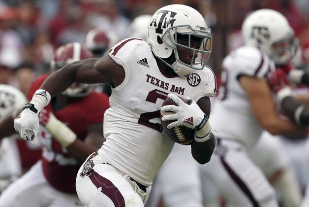 Texas A&M wide receiver Speedy Noil (2) carries the ball on a kick-return during the first half of an NCAA college football game against Alabama, Saturday, Oct. 18, 2014, in Tuscaloosa, Ala. (AP Photo/Butch Dill)