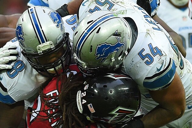 Atlanta Falcons running back Devonta Freeman (24), bottom centre, is challenged by Detroit Lions outside linebacker DeAndre Levy (54) during the NFL football game at Wembley Stadium, London, Sunday, Oct. 26, 2014.  (AP Photo/Tim Ireland)