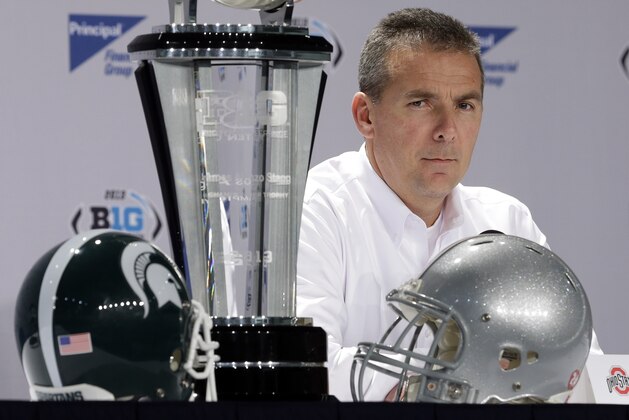 Ohio State head coach Urban Meyer responds to a question during a news conference for the Big Ten Conference championship NCAA college football game on Friday, Dec. 6, 2013, in Indianapolis. Ohio State is to play Michigan State, Saturday for the championship. (AP Photo/Darron Cummings)