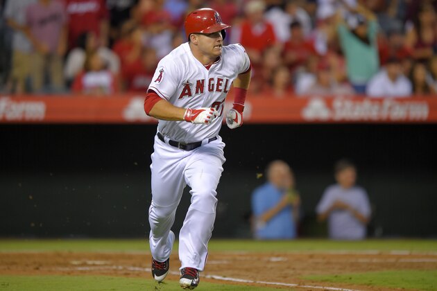 Los Angeles Angels' Mike Trout runs to first after hitting a two-run home run during the third inning of a baseball game against the Texas Rangers, Saturday, Sept. 20, 2014, in Anaheim, Calif. (AP Photo/Mark J. Terrill)