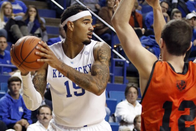 Kentucky's Willie Cauley-Stein (15) looks for an open teammate near Pikeville's Colt Chapman (12) during the second half of an NCAA college basketball exhibition, Sunday, Nov. 2, 2014, in Lexington, Ky. Kentucky won 116-68. (AP Photo/James Crisp)