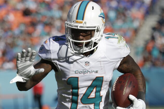 Miami Dolphins wide receiver Jarvis Landry (14) runs the ball for a touchdown during the second half of an NFL football game against the San Diego Chargers, Sunday, Nov. 2, 2014, in Miami Gardens, Fla.  (AP Photo/Lynne Sladky)