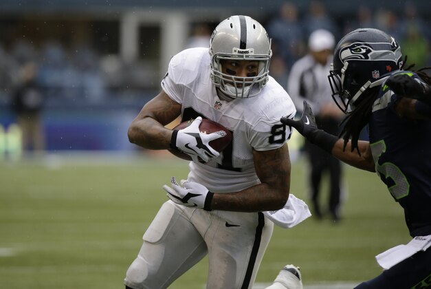Oakland Raiders Oakland Raiders tight end Mychal Rivera carries the ball against the Seattle Seahawks in the first half of an NFL football game, Sunday, Nov. 2, 2014, in Seattle. (AP Photo/Elaine Thompson)