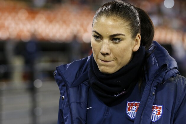 United States goalkeeper Hope Solo walks on the sidelines before a CONCACAF soccer match against Haiti, at RFK Stadium, Monday, Oct. 20, 2014, in Washington. (AP Photo/Alex Brandon)
