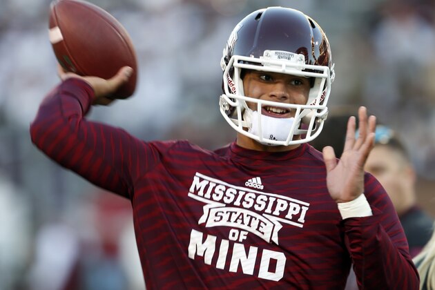 STARKVILLE, MS - NOVEMBER 1:  Dak Prescott, quarterback of the Mississippi State Bulldogs, warms up before the game against Arkansas at Davis Wade Stadium on November 1, 2014, in Starkville, Mississippi. (Photo by Butch Dill/Getty Images)