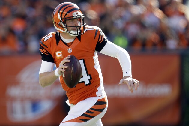 Cincinnati Bengals quarterback Andy Dalton scrambles as he looks to throw against the Jacksonville Jaguars during the first half of an NFL football game in Cincinnati, Sunday, Nov. 2, 2014. (AP Photo/AJ Mast)