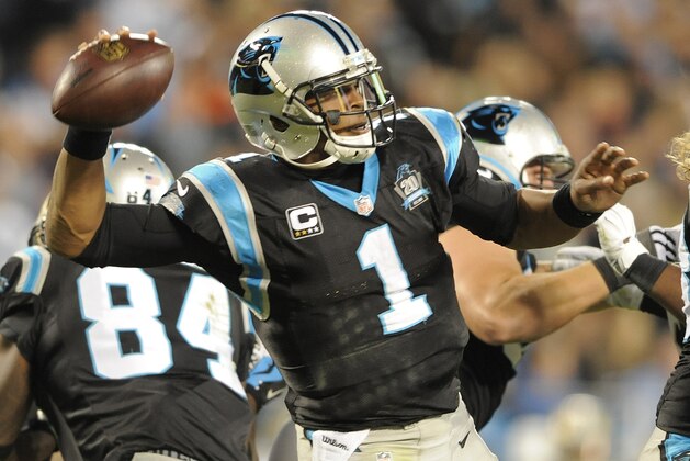 Carolina Panthers quarterback Cam Newton (1) passes against the New Orleans Saints in the second half of an NFL football game in Charlotte, N.C., Thursday, Oct. 30, 2014. (AP Photo/Mike McCarn)