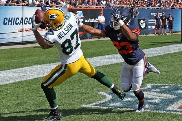 CHICAGO, IL - SEPTEMBER 28:  Jordy Nelson #87 of the Green Bay Packers catches a touchdown pass in front of  Kyle Fuller #23 of the Chicago Bears during the second quarter at Soldier Field on September 28, 2014 in Chicago, Illinois. (Photo by Jonathan Daniel/Getty Images)
