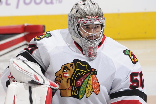 TORONTO, ON - NOVEMBER 01: Corey Crawford #50 of the Chicago Blackhawks stretches during NHL game action against the Toronto Maple Leafs on November 1, 2014 at the Air Canada Centre in Toronto, Ontario, Canada. (Photo by Graig Abel/NHLI via Getty Images)