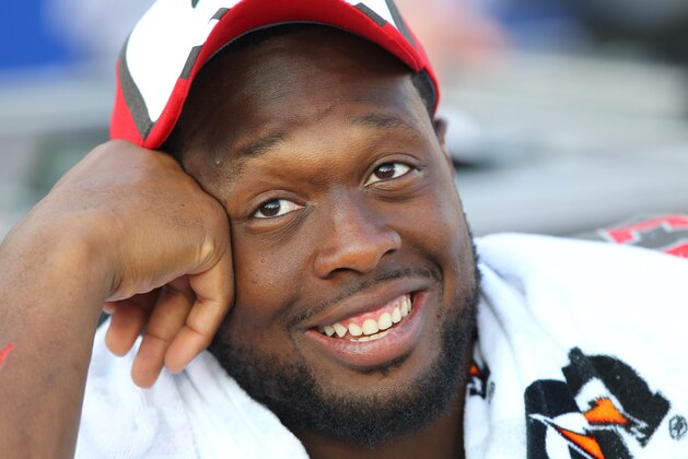 Tampa Bay Buccaneers defensive tackle Gerald McCoy (93) watches his team play during the second half of a preseason NFL football game against the Buffalo Bills Saturday, Aug. 23, 2014, in Orchard Park, N.Y. (AP Photo/Bill Wippert)