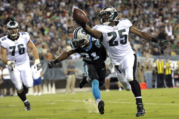 Philadelphia Eagles running back LeSean McCoy, right,  scores a touchdown past Carolina Panthers safety Mike Mitchell during the first half of a preseason NFL football game, Thursday, Aug. 15, 2013, in Philadelphia. (AP Photo/Michael Perez)