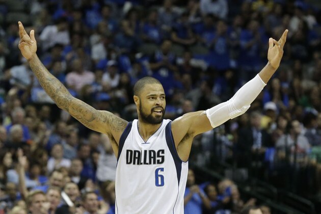 Dallas Mavericks center Tyson Chandler (6) raises his arms after a play during the first half of an NBA basketball game against the Utah Jazz, Thursday, Oct. 30, 2014, in Dallas. (AP Photo/LM Otero)