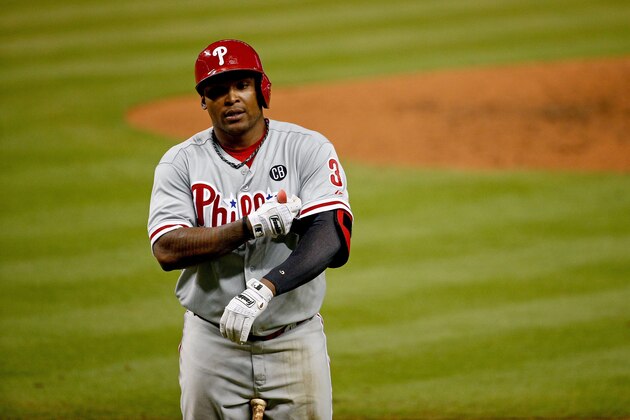 MIAMI, FL - SEPTEMBER 24: Marlon Byrd #3 of the Philadelphia Phillies reacts after striking out to end the third inning leaving base runners stranded on second and third base during the game against the Miami Marlins at Marlins Park on September 24, 2014 in Miami, Florida.  (Photo by Rob Foldy/Getty Images)